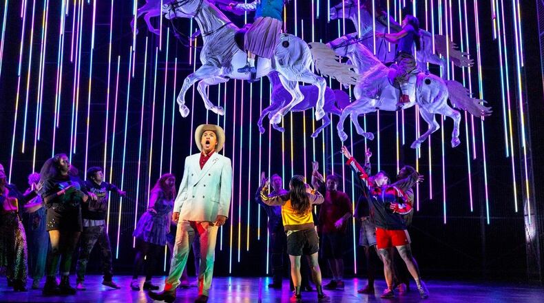This image released by the Scottish Opera shows Justin Austin, foreground center, and Susan Bullock, top center, during a performance of "The Galloping Cure," at Theatre Royal Glasgow on July 28, 2026 in Glasgow, Scotland. (Antonia Bain/Scottish Opera via AP)