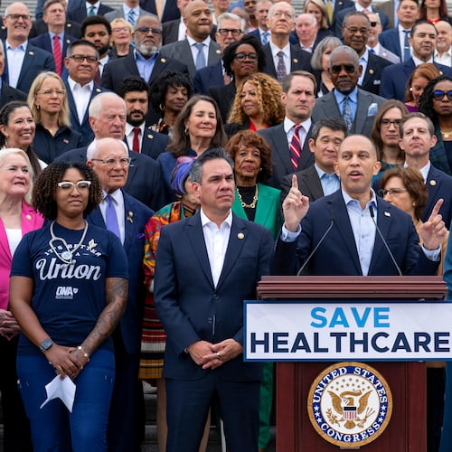 House Minority Leader Hakeem Jeffries, D-N.Y., (center) flanked by colleagues and supporters, presses Democrats' case for extending health care subsidies at a news conference in Washington on Tuesday, Sept. 30, 2025. (J. Scott Applewhite/AP)
