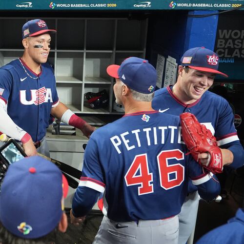 The United States team celebrates after defeating the Dominican Republic at a World Baseball Classic semifinal game, Sunday, March 15, 2026, in Miami. (AP Photo/Lynne Sladky)