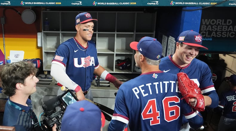 The United States team celebrates after defeating the Dominican Republic at a World Baseball Classic semifinal game, Sunday, March 15, 2026, in Miami. (AP Photo/Lynne Sladky)