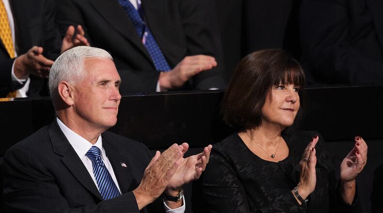 Republican vice presidential candidate, Indiana Gov. Mike Pence, along with his wife Karen Pence watch the second day of the Republican National Convention on Tuesday at the Quicken Loans Arena in Cleveland. Jeff Swensen/Getty Images
