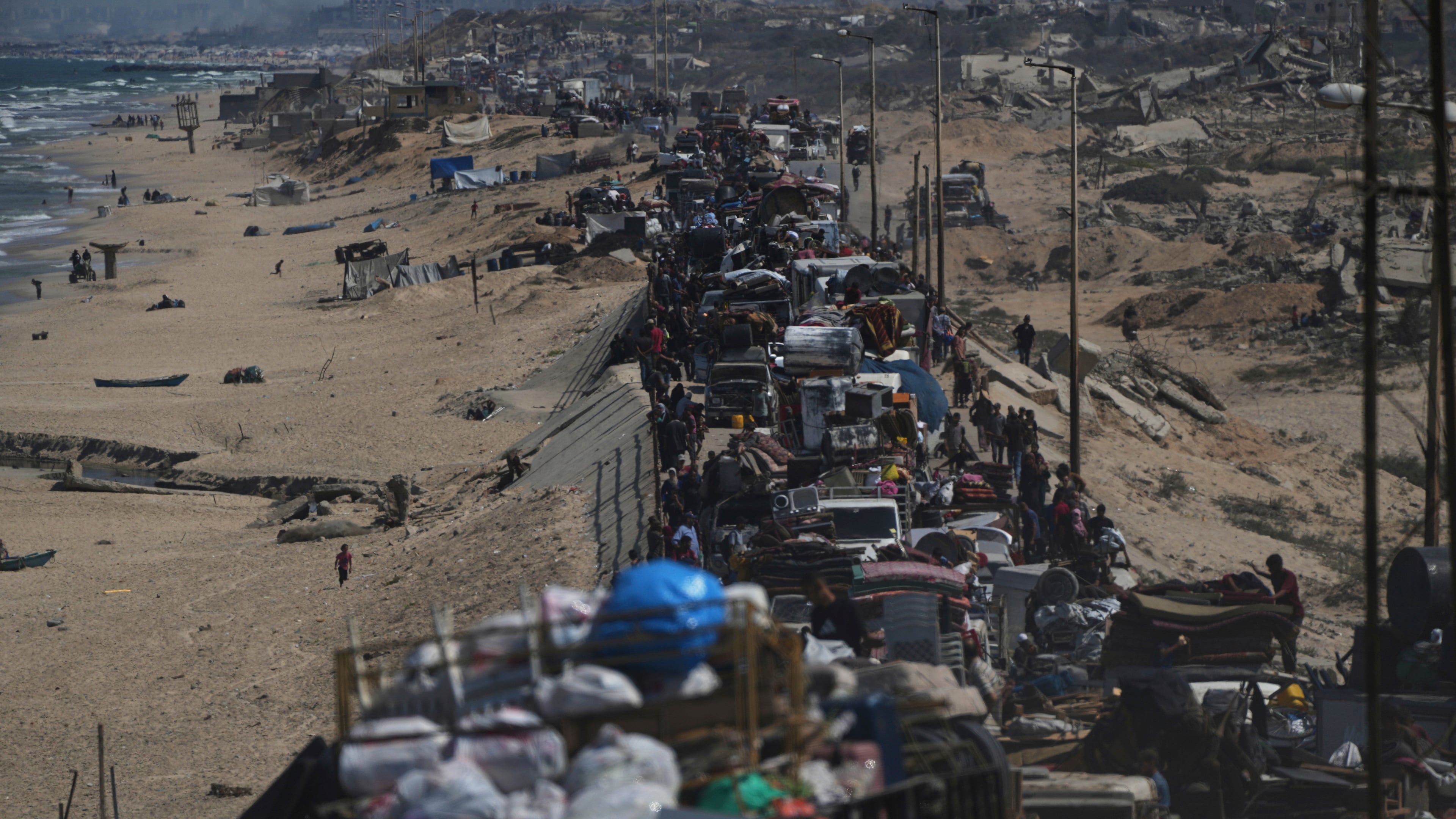 Displaced Palestinians flee northern Gaza along the coastal road toward the south, after Israel's military says its expanded operation in Gaza City has begun and warns residents to leave, Tuesday, Sept. 16, 2025. (AP Photo/Abdel Kareem Hana)