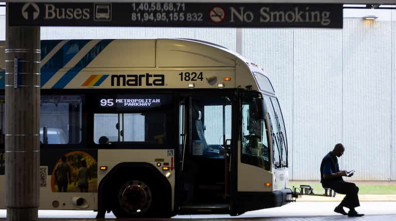 A bus driver waits at the West End MARTA station in Atlanta. (Arvin Temkar/AJC 2025)