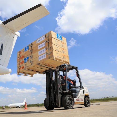 Workers load World Health Organization (WHO) emergency supplies onto a United Nations plane in Nairobi, Kenya, Wednesday, May 20, 2026, headed for Congo to combat the Ebola outbreak in Ituri province. (AP Photo/Andrew Kasuku)