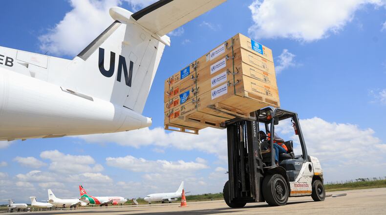 Workers load World Health Organization (WHO) emergency supplies onto a United Nations plane in Nairobi, Kenya, Wednesday, May 20, 2026, headed for Congo to combat the Ebola outbreak in Ituri province. (AP Photo/Andrew Kasuku)