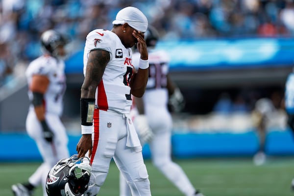 Falcons quarterback Michael Penix Jr. walks to the sideline during their 30-0 blowout loss to the Panthers on Sunday, Sept. 21, 2025, in Charlotte, N.C. (Rusty Jones/AP)