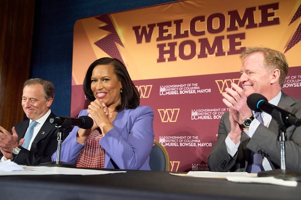 Washington Commanders controlling owner Josh Harris, from left, District of Columbia Mayor Muriel Bowser and NFL Commissioner Roger Goodell announce a new home for the NFL football team on the site of the old RFK Stadium, Monday, April 28, 2025, at the National Press Club in Washington. (AP Photo/Jacquelyn Martin)