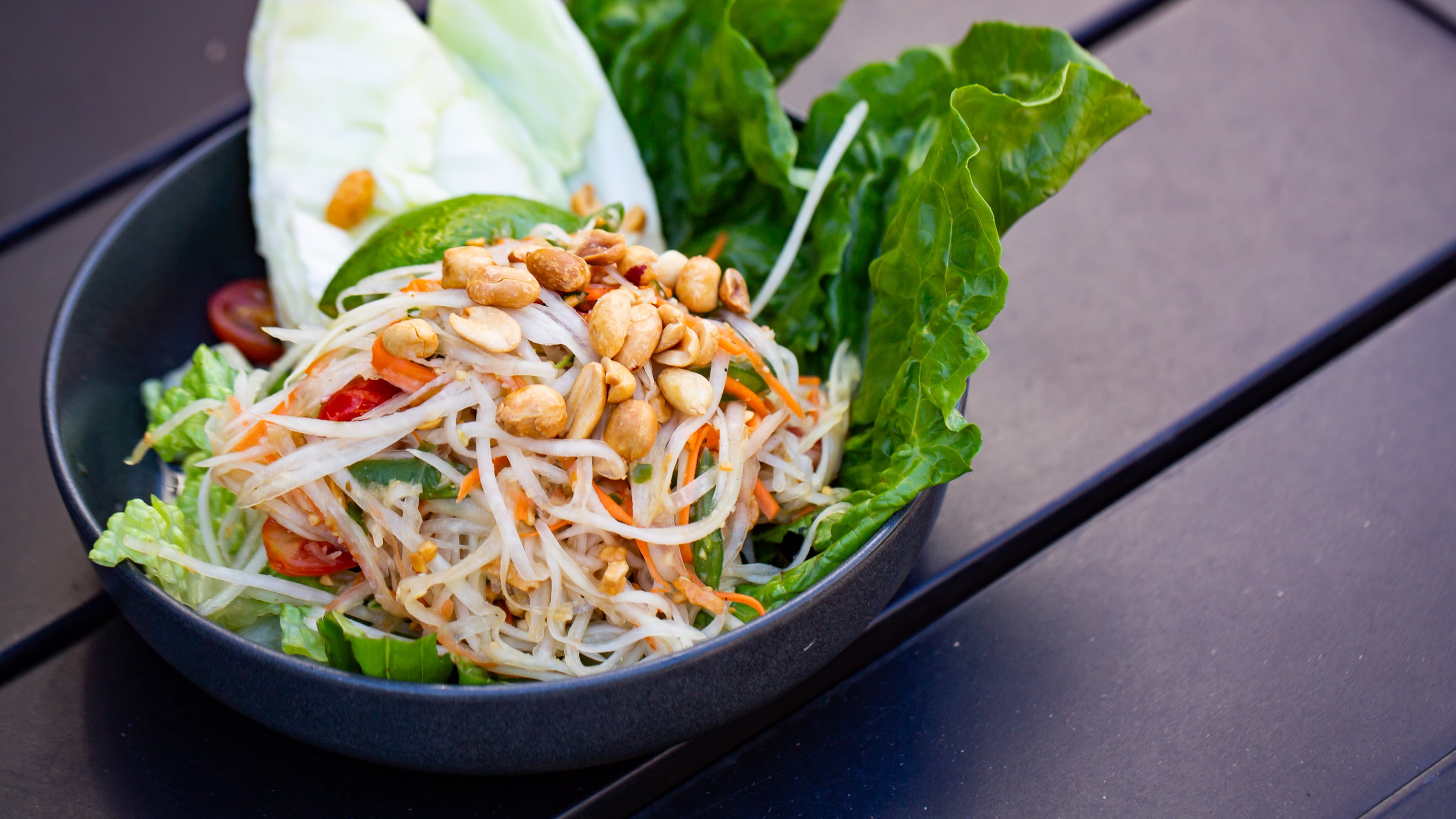 A Thai papaya salad, known as som tum, will wake up your taste buds at 26 Thai Kitchen & Bar. (Ryan Fleisher for the AJC)