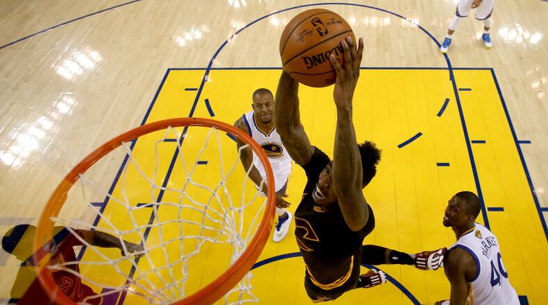 Iman Shumpert of the Cavaliers dunks the ball against Harrison Barnes (40) of the Warriors in Game 5 of the NBA Finals. (Photo by Ezra Shaw/Getty Images)