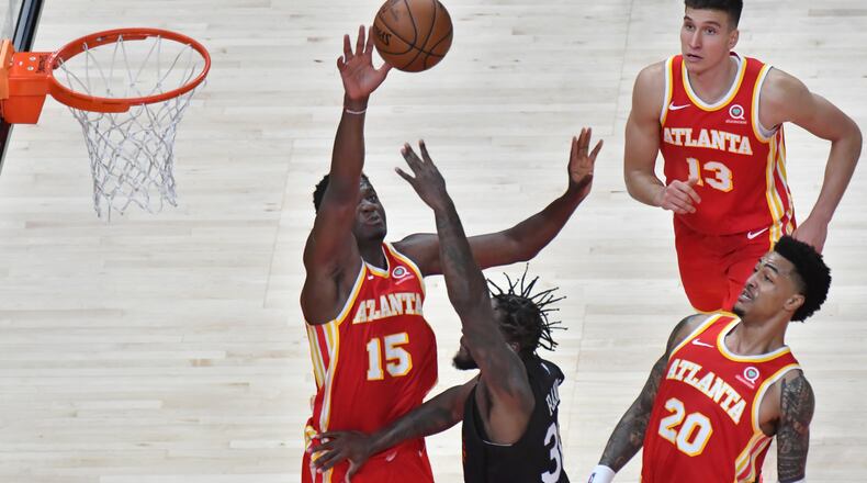 Hawks center Clint Capela (15) blocks a shot by New York Knicks forward Julius Randle (30) in the late going of the Hawks'  Game 3 victory. (Hyosub Shin / Hyosub.Shin@ajc.com)