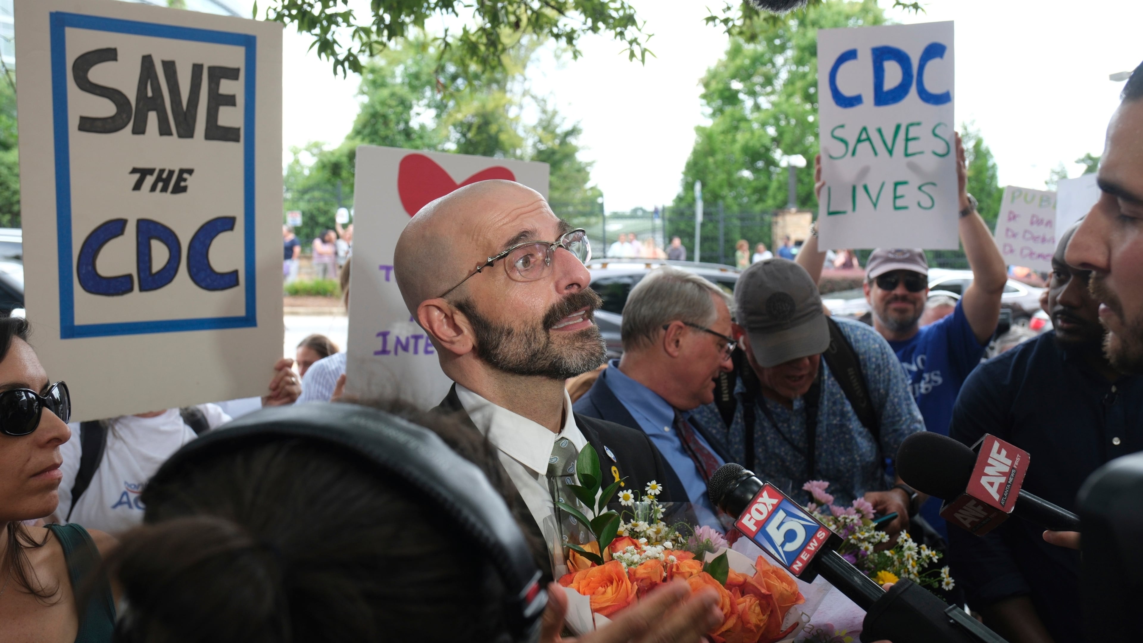 Dr. Demetre Daskalakis talks to reporters as workers and supporters rally for departing scientific leaders at the Centers for Disease Control and Prevention outside the CDC headquarters, Thursday, Aug. 28, 2025, in Atlanta. (Ben Gray/AP)