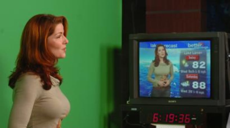 Dagmar Midcap stands against a green screen as she gives the weekend forecast. Midcap, who does not claim to be a meteorologist, has had small parts in 'Catwoman' and on TV shows.