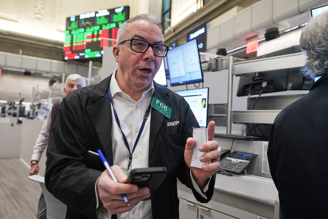 Options trader Joseph D'Arrigo works on the floor of the New York Stock Exchange, Tuesday, Dec. 2, 2025. (AP Photo/Richard Drew)