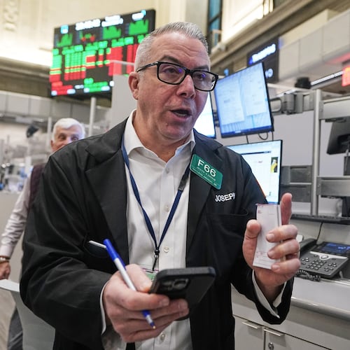 Options trader Joseph D'Arrigo works on the floor of the New York Stock Exchange, Tuesday, Dec. 2, 2025. (AP Photo/Richard Drew)