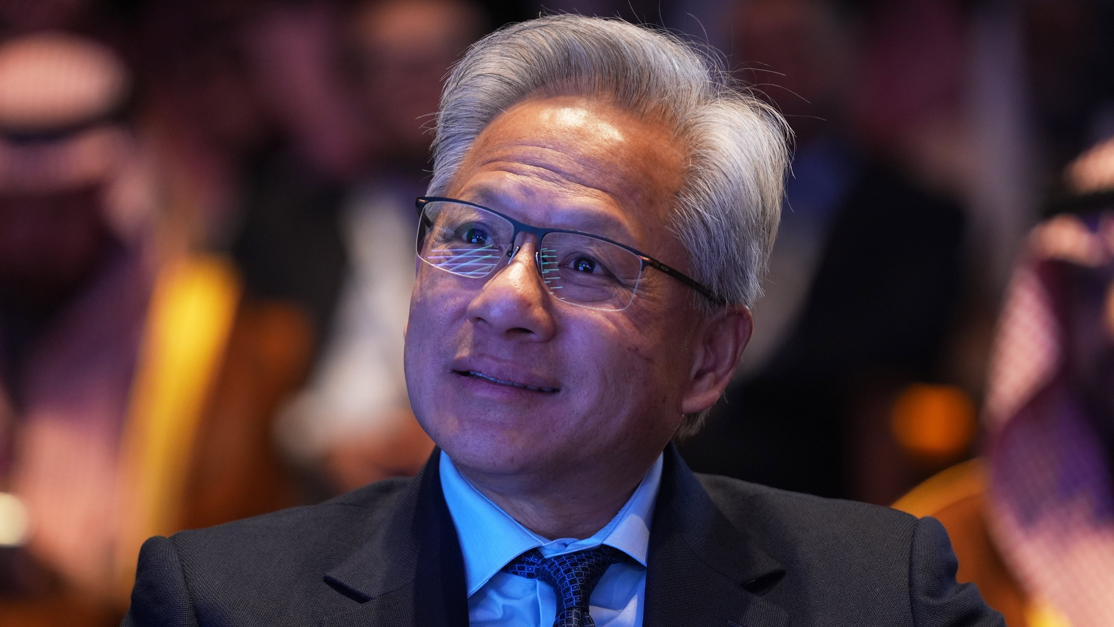Nvidia CEO Jensen Huang listens as President Donald Trump speaks during the Saudi Investment Forum at the Kennedy Center, Wednesday, Nov. 19, 2025, in Washington. (AP Photo/Evan Vucci)