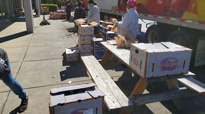 Atlanta Community Food Bank workers distribute food donations. The Food Bank works with over 700 nonprofits to serve more than 755,000 people each year.