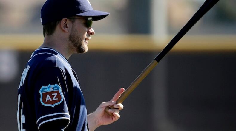San Diego Padres manager Andy Green watches a drill during spring training baseball practice Saturday, Feb. 20, 2016, in Peoria, Ariz. (AP Photo/Charlie Riedel)