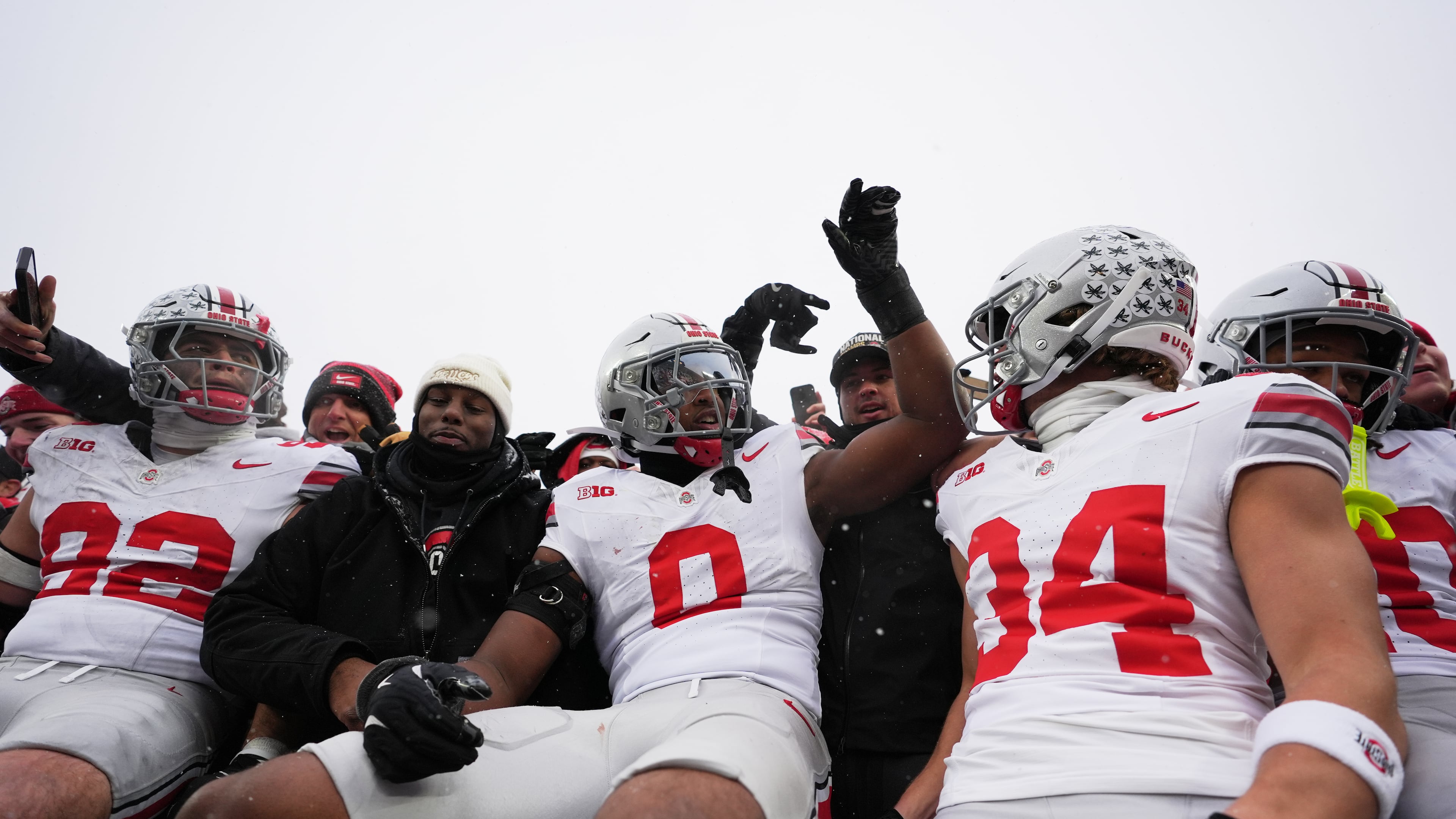 Ohio State Buckeyes defensive end Caden Curry, linebacker Sonny Styles, and wide receiver Brennen Schramm, from left, celebrate after the team's win against Michigan in an NCAA college football game, Saturday, Nov. 29, 2025, in Ann Arbor, Mich. (AP Photo/Ryan Sun)