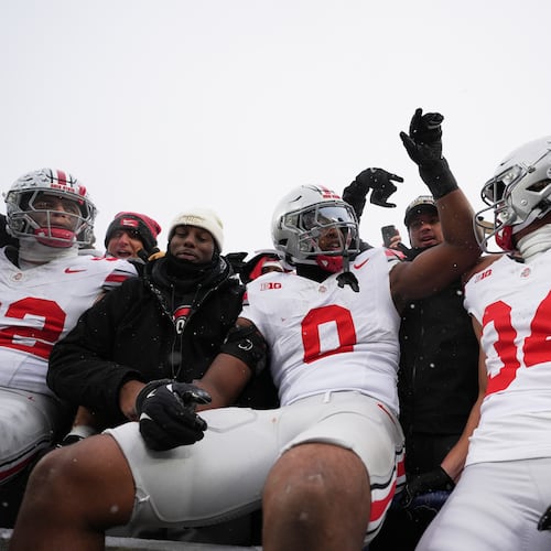 Ohio State Buckeyes defensive end Caden Curry, linebacker Sonny Styles, and wide receiver Brennen Schramm, from left, celebrate after the team's win against Michigan in an NCAA college football game, Saturday, Nov. 29, 2025, in Ann Arbor, Mich. (AP Photo/Ryan Sun)