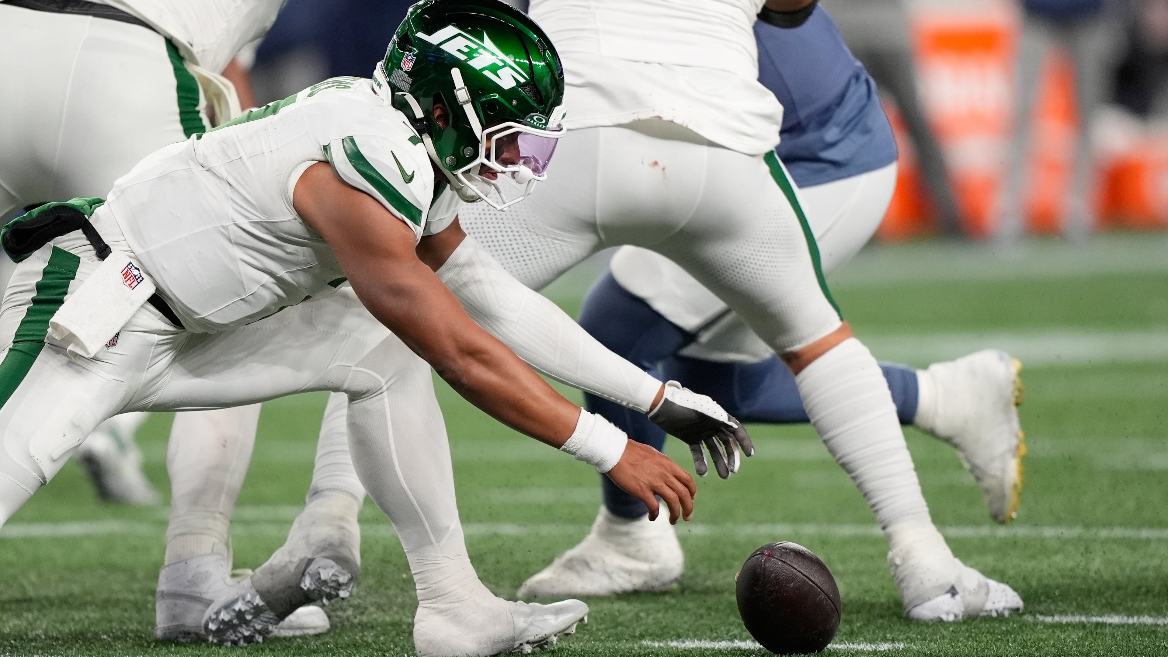 New York Jets quarterback Justin Fields fumbles the ball during the second half of an NFL football game against the New England Patriots, Thursday, Nov. 13, 2025, in Foxborough, Mass. (AP Photo/Robert F. Bukaty)