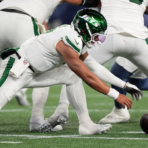 New York Jets quarterback Justin Fields fumbles the ball during the second half of an NFL football game against the New England Patriots, Thursday, Nov. 13, 2025, in Foxborough, Mass. (AP Photo/Robert F. Bukaty)