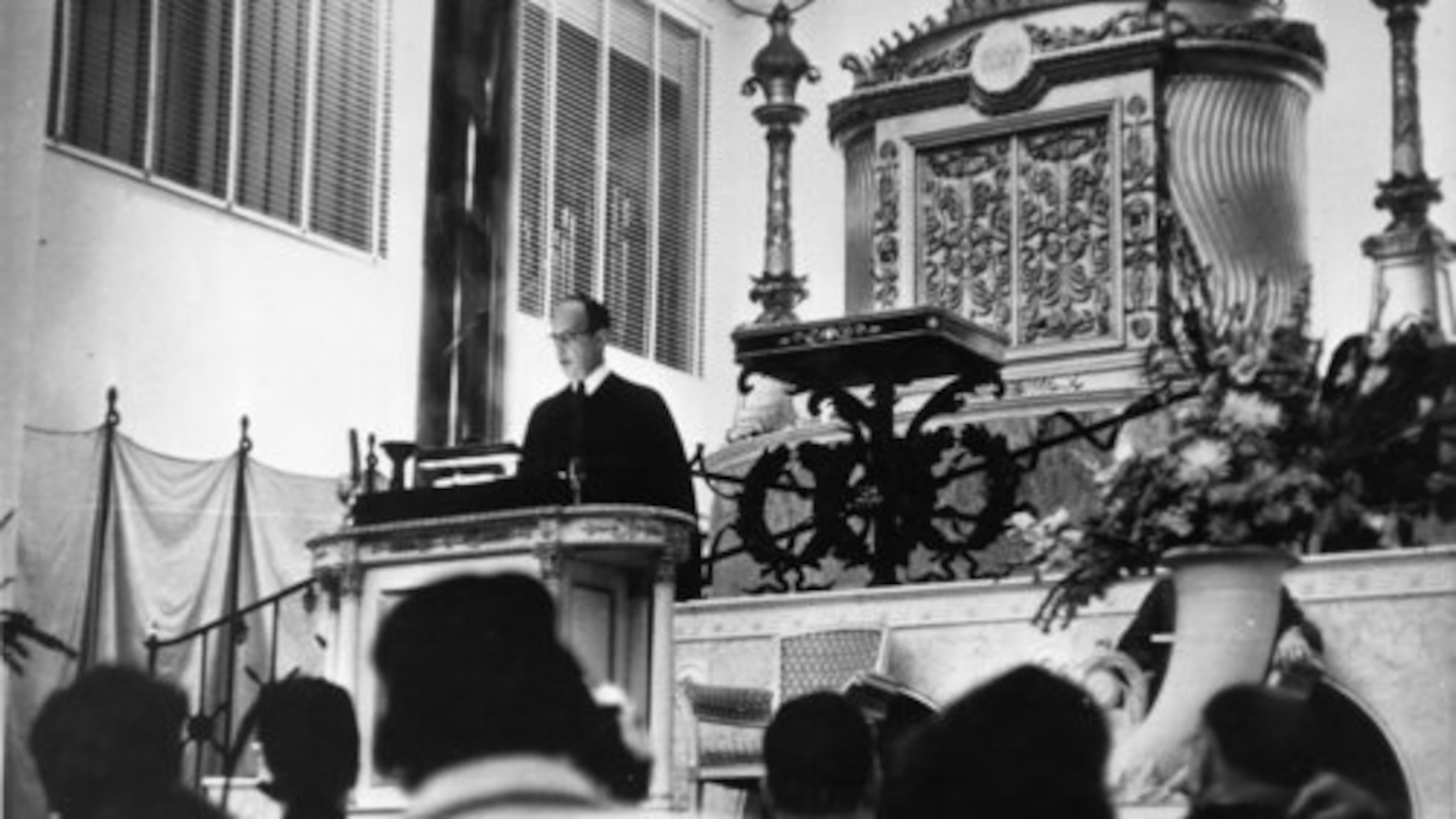 Five days after the 1958 bombing of The Temple in Atlanta, Rabbi Jacob Rothschild delivered his sermon, "And None Shall Make Them Afraid," in a sanctuary with its shattered windows, filled to capacity. (AJC File)