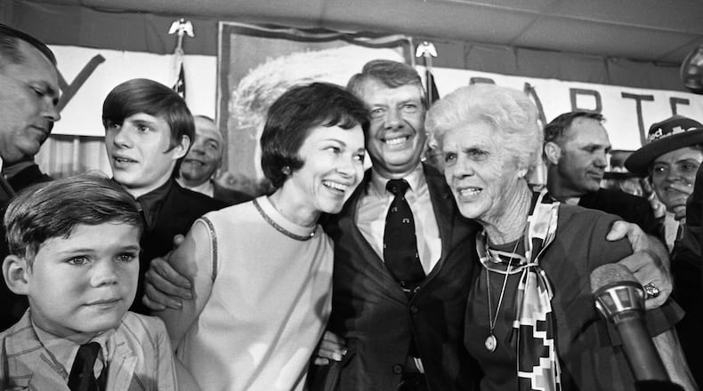 1970: Four years later, Jimmy Carter would be elected governor on his second try. Here, he celebrates on election night with Rosalynn and his mother Miss Lillian. (Billy Downs / AJC Archive at the GSU Library AJCN089-019b)