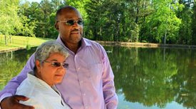 David Moody Jr. and his wife of more than 30 years, Karla, relax by the pond at their Lithonia home. “I was shocked,” Karla said about hearing about the sexual abuse her husband suffered as a 10-year-old. “And as a nurse, my shock meter is a bit high.” AJC FILE PHOTO