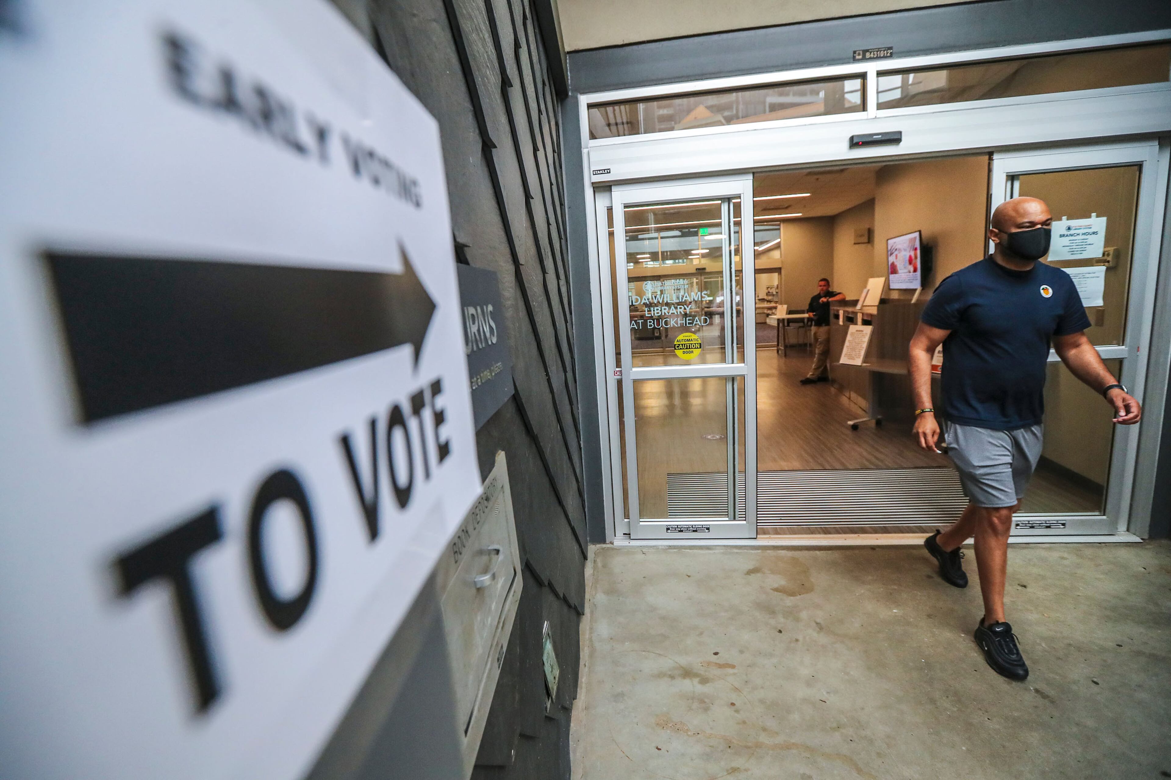 Kenneth French leaves the Buckhead Library after early voting in 2021. (John Spink/AJC/TNS)
