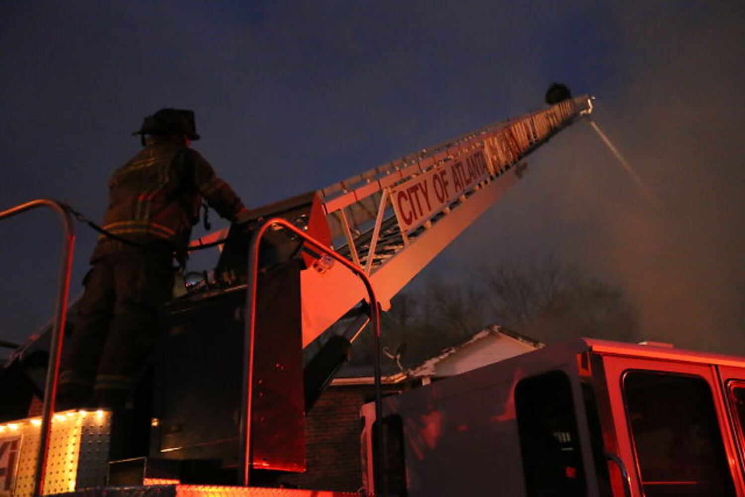 Firefighters contend with strong winds, cold weather