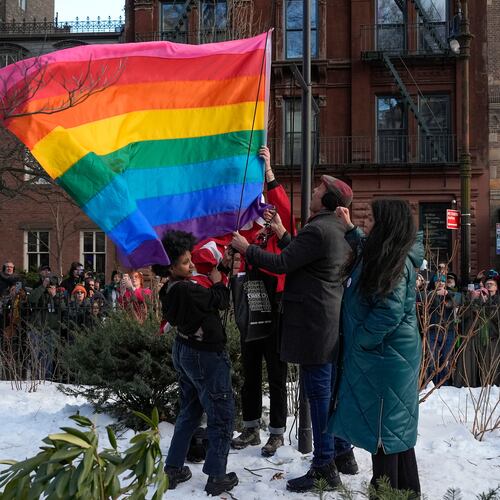 FILE - New York politicians and activists raise a rainbow flag on a pole in Christopher Park across the street from the Stonewall Inn, Thursday, Feb. 12, 2026, in New York, a few days after it was removed by the National Park Service to comply with guidance from the Trump administration. (AP Photo/Yuki Iwamura, File)