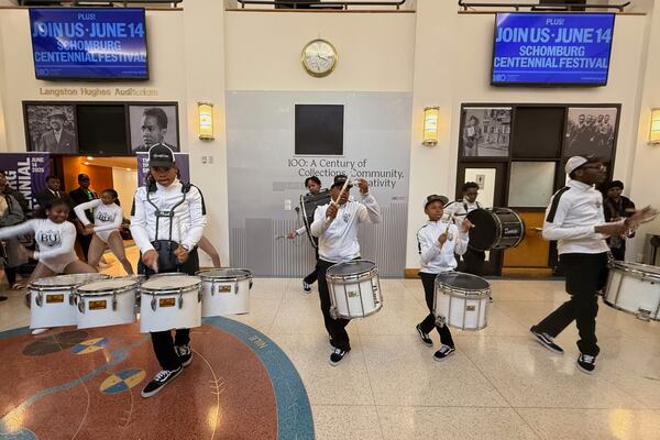 Brooklyn United Marching Band kicks in the Langston Hughes Auditorium celebrating the centennial of the Schomburg Center for Research in Black Culture in New York on Saturday, June 14, 2025. (AP Photo/Jaylen Green)