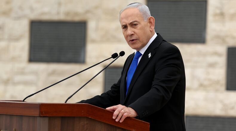 Israel's Prime Minister Benjamin Netanyahu attends a ceremony commemorating Israel's Remembrance Day for fallen soldiers, or Yom HaZikaron, at the Military Cemetery on Mount Herzl in Jerusalem, Tuesday April 21, 2026. (Ilia Yefimovich/Pool Photo via AP)