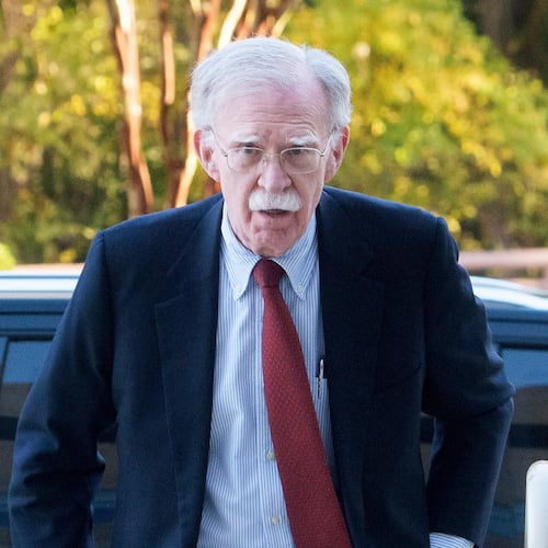 Former Trump administration national security adviser John Bolton, left, arrives for his arraignment at the federal courthouse in Greenbelt, Md., Friday, Oct. 17, 2025. (AP Photo/Rod Lamkey, Jr.)