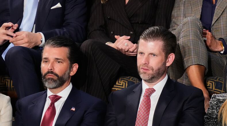 FILE - Donald Trump Jr. and Eric Trump listen to President Donald Trump's State of the Union address at the U.S. Capitol in Washington, Feb. 24, 2026. (AP Photo/Alex Brandon, file)