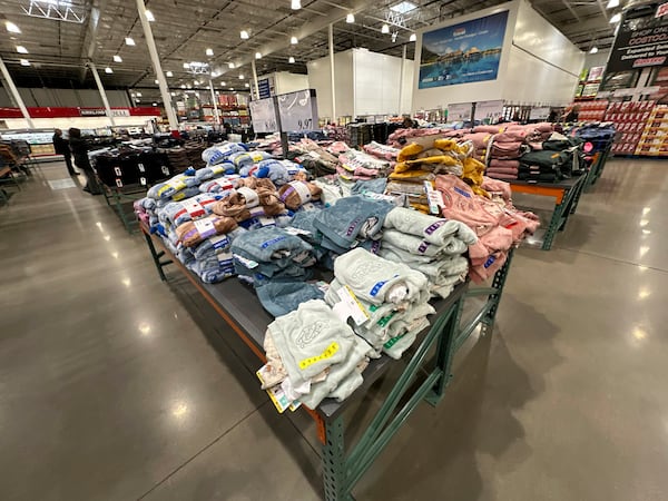 FILE - Children's clothing sits stacked on a table for shoppers in a Costco warehouse Thursday, Jan. 23, 2025, in Sheridan, Colo. (AP Photo/David Zalubowski, File)
