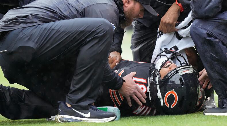 Chicago Bears quarterback Caleb Williams (18) lies on the field during the second half of an NFL football game against the Minnesota Vikings in Chicago, Sunday, Sept. 20, 2026. (AP Photo/Nam Y. Huh)