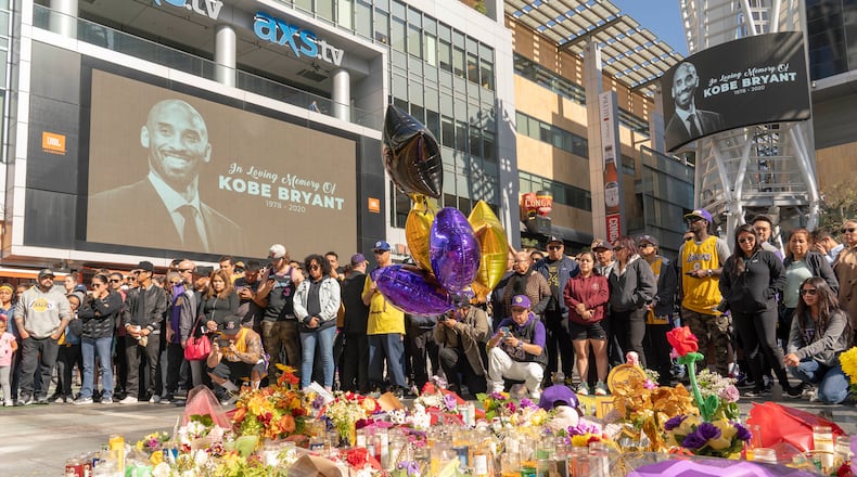 Fans gather Monday in Los Angeles at a makeshift memorial to Kobe Bryant. (Kyle Grillot/The New York Times)