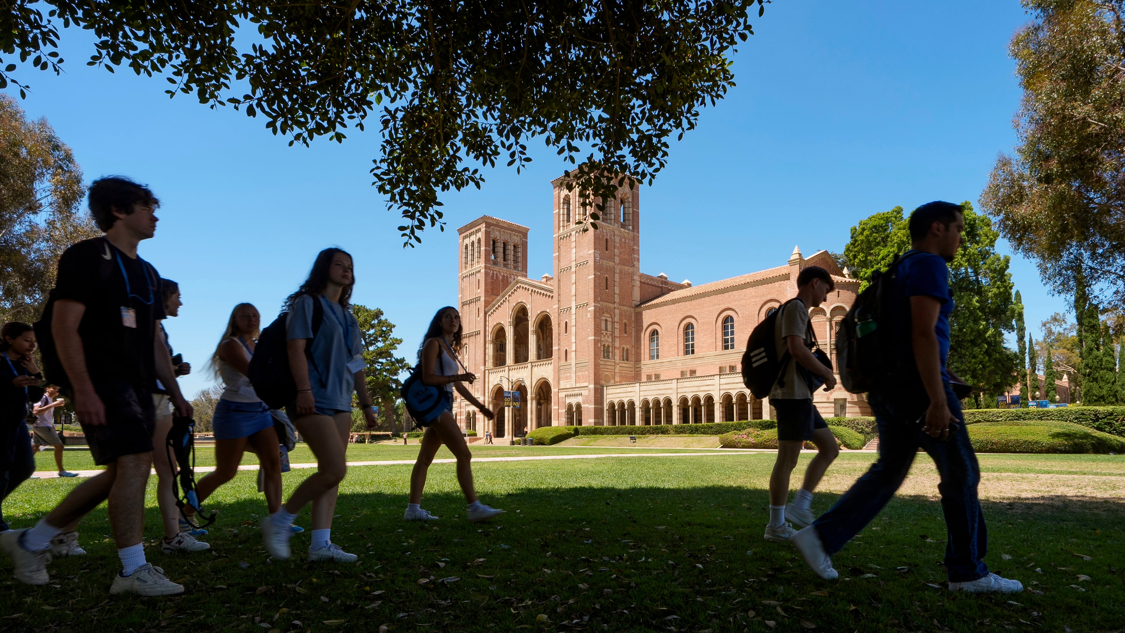FILE - Students walk past Royce Hall at the UCLA campus in Los Angeles, Aug. 15, 2024. (AP Photo/Damian Dovarganes, File)