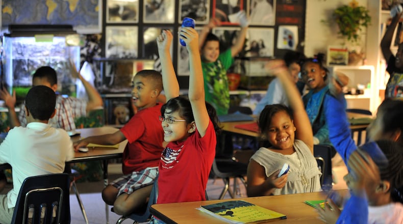 Students at Lilburn Elementary School celebrate after choosing the correct answer during an interactive science lesson in this file photo. Elementary students make up almost 45 percent of Gwinnett County students.