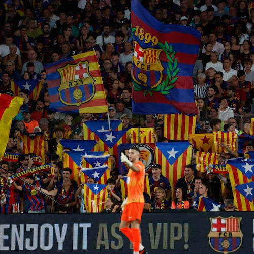 Supporters lift independence flags during a Spanish La Liga soccer match between Barcelona and Athletic in Barcelona, Spain, Thursday, Aug. 27, 2026. (AP Photo/Joan Monfort)