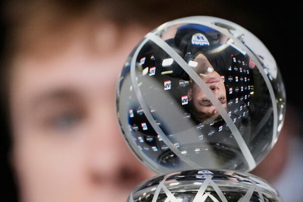 Duke forward Cooper Flagg, Associated Press Player of the Year, is reflected in his trophy as he listens to a question during a news conference ahead of the Final Four college basketball games in the NCAA Tournament Friday, April 4, 2025, in San Antonio. (AP Photo/Eric Gay)