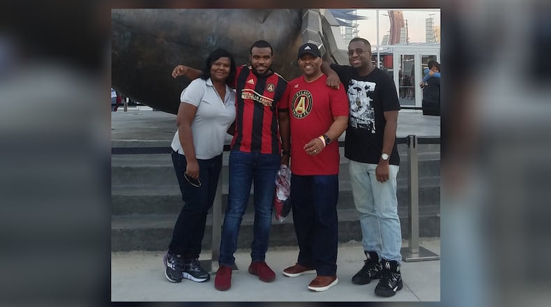 The Dunlap family (left to right) Felecia, Chris, Eric and Jordan at an Atlanta United match. Eric Dunlap is a breast cancer survivor. CREDIT: FAMILY PHOTO
