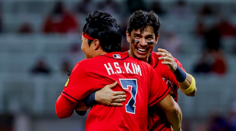 Atlanta Braves Ha-Seong Kim (7) celebrates with Mauricio Dubón after Kim scored the game-winning run against the Philadelphia Phillies during the 11th inning of a baseball game, Friday, Sept. 11, 2026, in Atlanta. (Erik S. Lesser/AP)