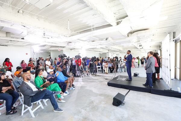 Both Atlanta Mayor Andre Dickens (center right) and Director of Cultural Affairs Adriane Jefferson said they want Atlantans to feel the ATL Culture House at The Center is their own despite the promotional events coinciding with the expected influx of tens of thousands of visitors in town for the World Cup. (Arvin Temkar/AJC)