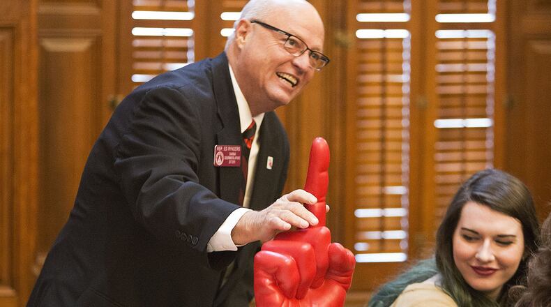 State Rep. Ed Rynders shows off the Georgia Bulldogs #1 finger before the beginning of the first day of the 2018 General Assembly in the Georgia House of Representatives in 2018. (Photo by Phil Skinner)