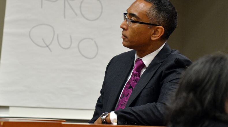 Suspended DeKalb County CEO Burrell Ellis, watches a video of his prior grand jury testimony, while being cross examined by Dekalb County District Attorney Robert James on Friday. Ellis is fighting charges that he intimidated companies doing business with DeKalb County into giving him campaign contributions. BRANT SANDERLIN / BSANDERLIN@AJC.COM