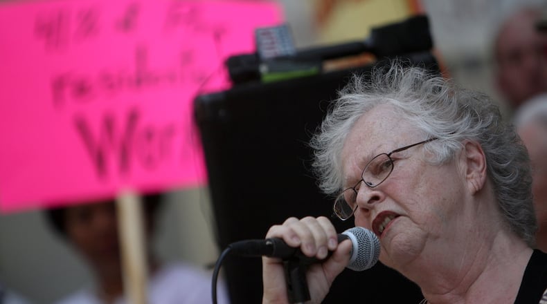 Anita Beaty rallies the crowd at the corner of Peachtree and Pine Streets during a protest about foreclosure issues at the homeless shelter in Atlanta on May 13, 2010. (Vino Wong / vwong@ajc.com)