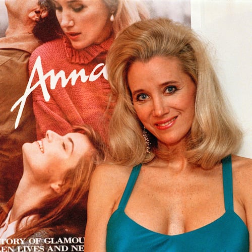 FILE - Sally Kirkland stands next to a poster of her film "Anna" in Los Angeles on Feb. 9, 1988. (AP Photo/Mark Terrill, File)