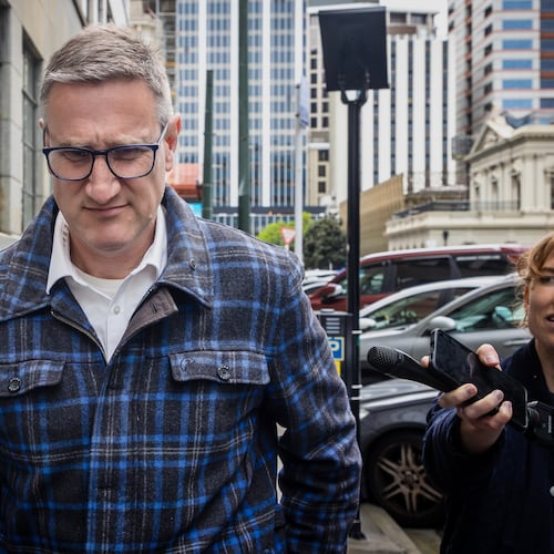 FILE - Former deputy police commissioner, Jevon McSkimming, walks from the High Court in Wellington, New Zealand, on Nov. 6, 2025. (Bruce MacKay/The Post via AP, File)